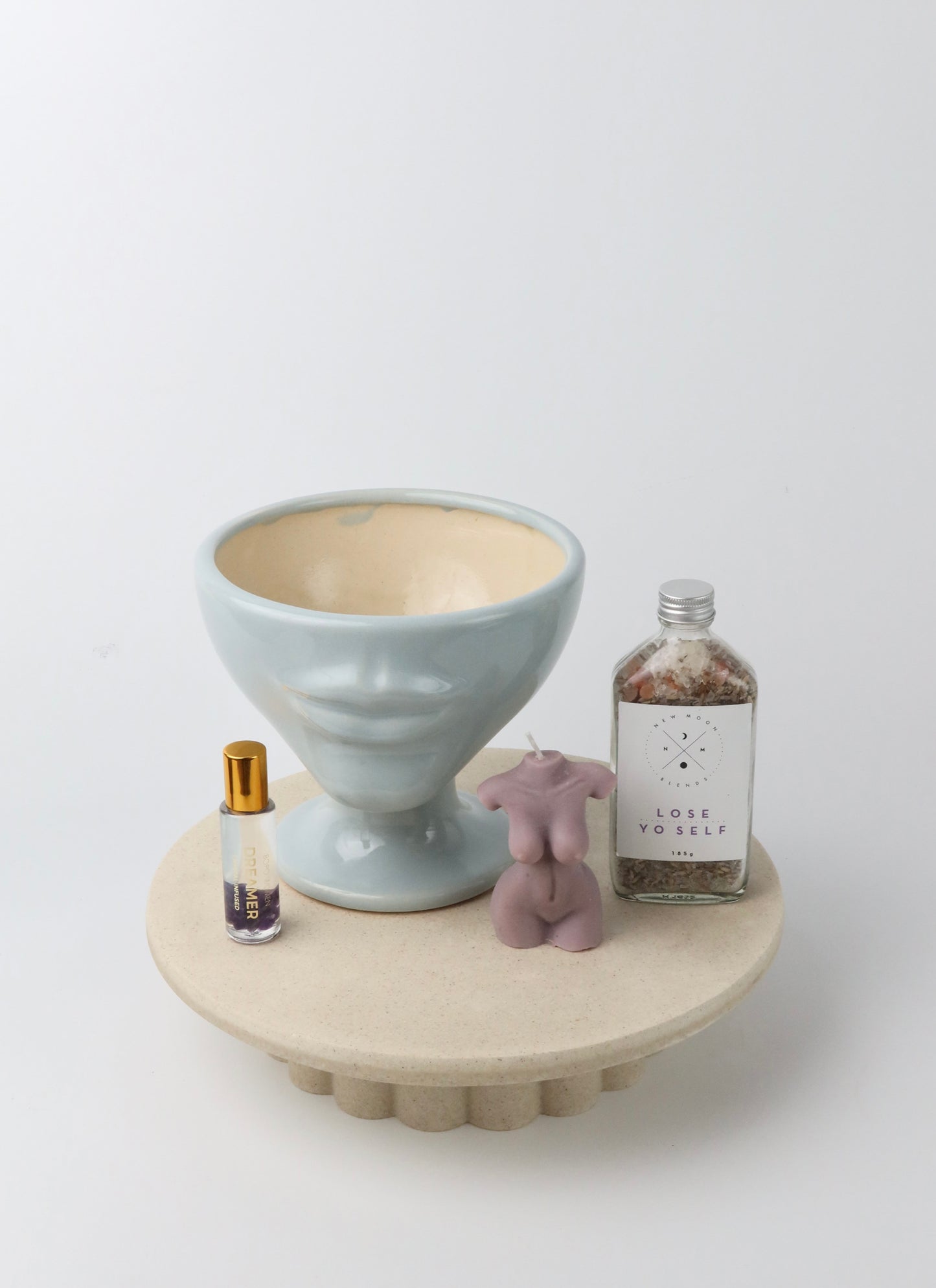 A fun and playful homeware, bath & body gift box. Including pale blue handmade ceramic lip vase, bath soaks, crystal perfume roller & lady soy wax candle. Gift wrapped and presented in our signature wrapping & branding.