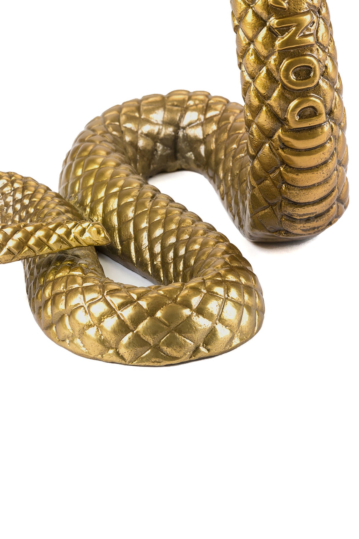 Gold snake ornament with the words "Don't Step On Me" engraved is from the Diesel Living - Wunderkammer collection by Seletti. A decorative piece made from aluminium.