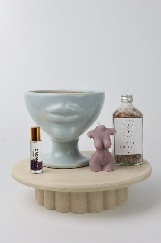 A fun and playful homeware, bath & body gift box. Including pale blue handmade ceramic lip vase, bath soaks, crystal perfume roller & lady soy wax candle. Gift wrapped and presented in our signature wrapping & branding.