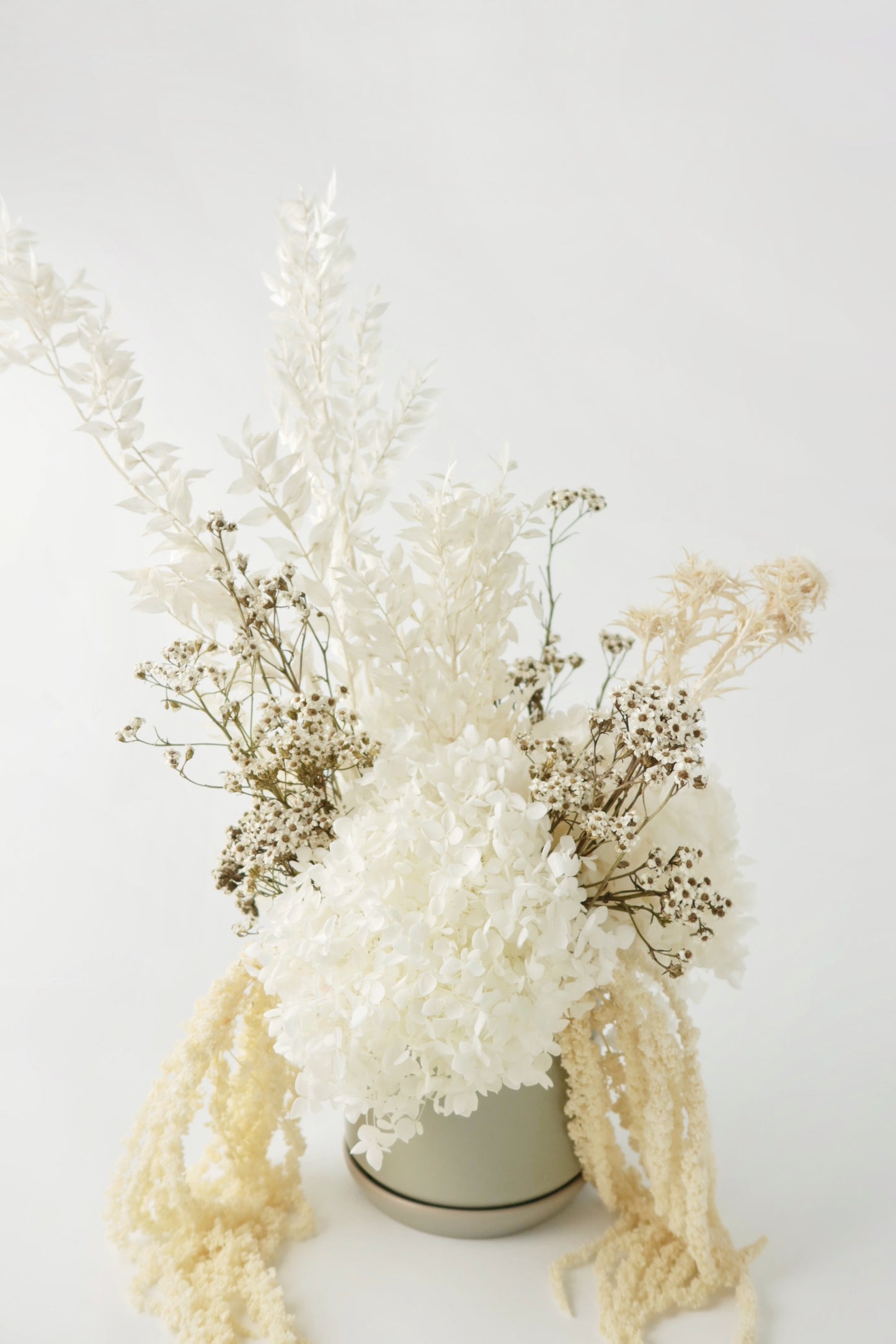 White and natural everlasting flower arrangement. 