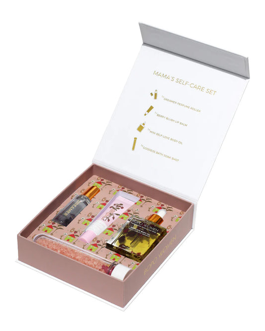 A bath and body gift set including body oil, perfume roller, bath soak and lip balm.