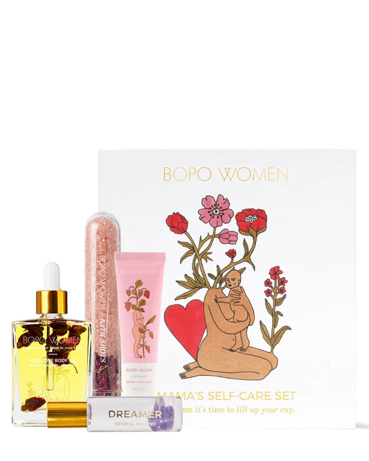 A bath and body gift set including body oil, perfume roller, bath soak and lip balm.