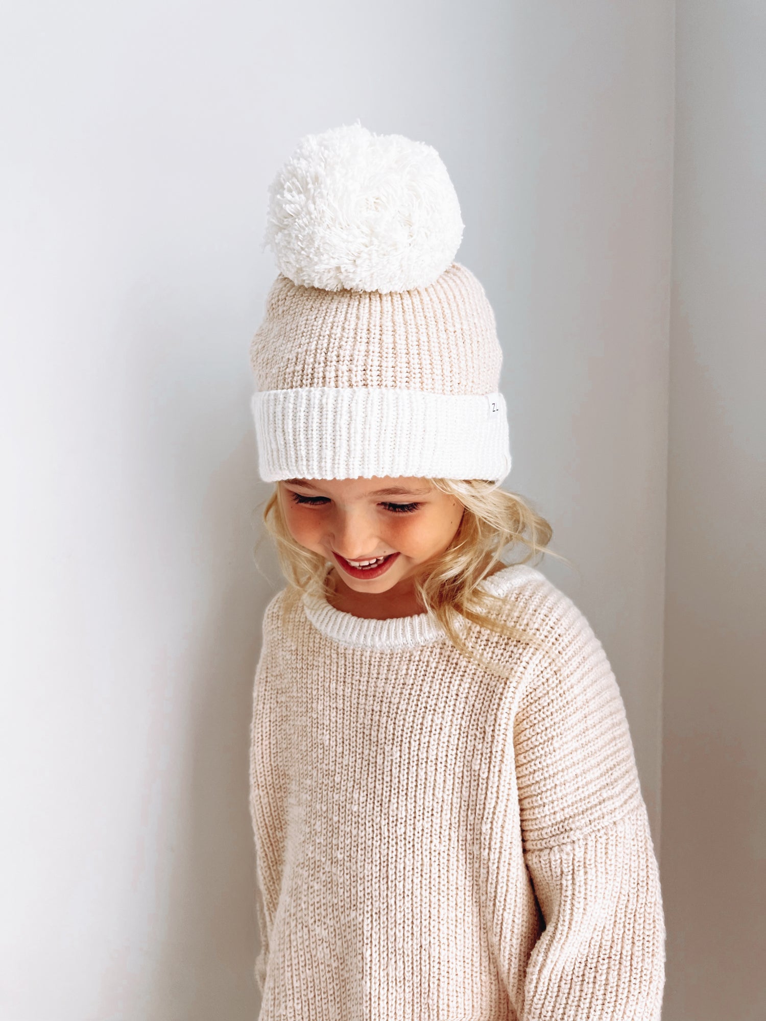 By Ziggy Lou - 100% cotton baby clothing. Featuring two tone petal beanie with pom pom.