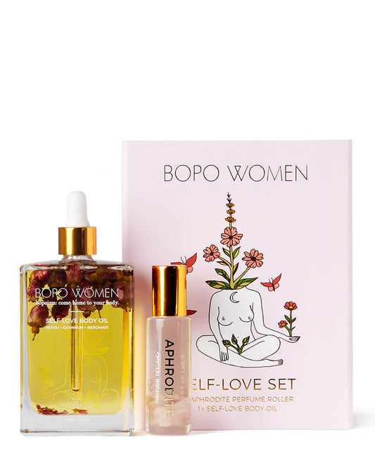 A Self-Love Gift Set including body oil and a crystal perfume roller. Presents in gift box.