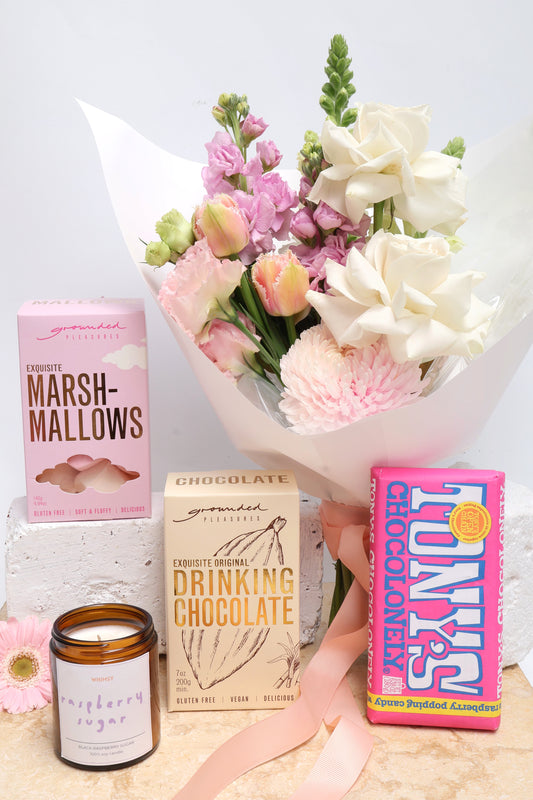 Sweet Tooth Flower & Treat Gift Hamper, including posy of flowers, vegan hot chocolate, marshmellows, raspberry chocolate & a soy wax candle.