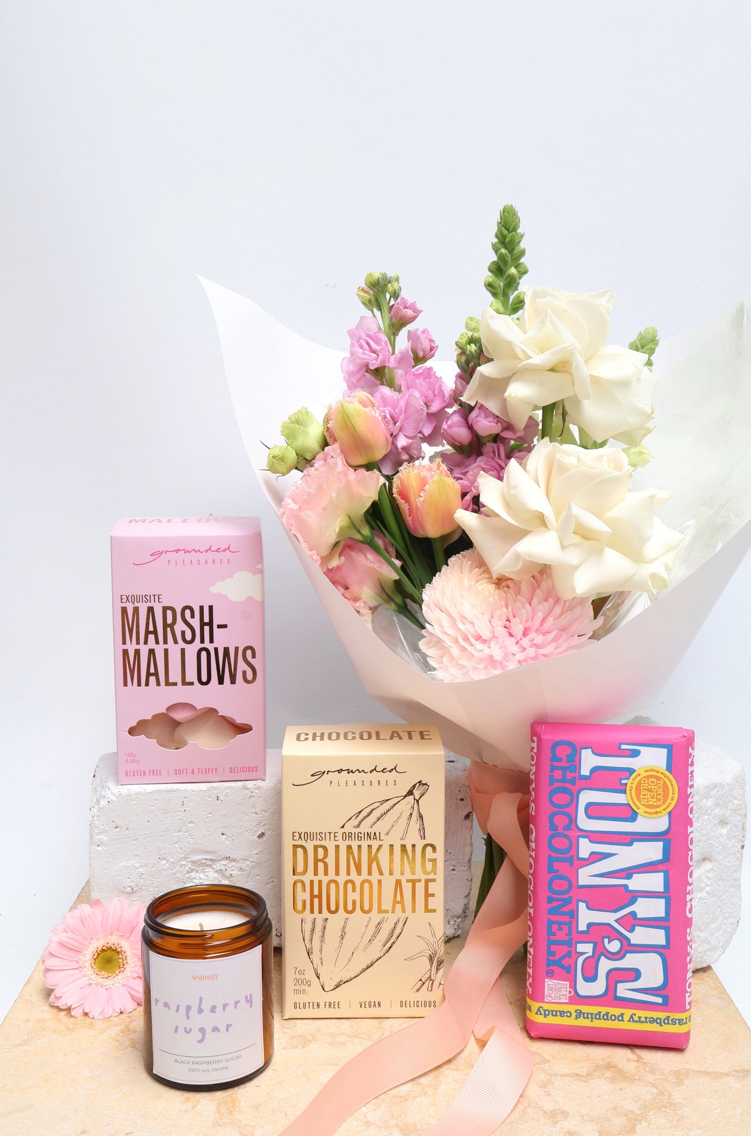 Sweet Tooth Flower & Treat Gift Hamper, including posy of flowers, vegan hot chocolate, marshmellows, raspberry chocolate & a soy wax candle.