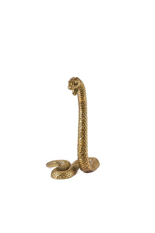 Gold snake ornament with the words "Don't Step On Me" engraved is from the Diesel Living - Wunderkammer collection by Seletti.  A decorative piece made from aluminium.